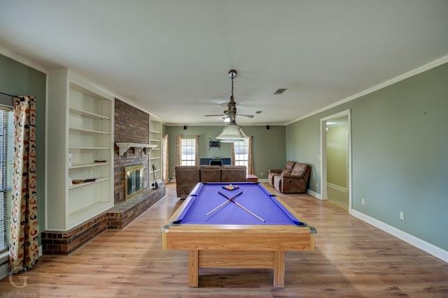 game room with built in features, crown molding, pool table, and wood-type flooring