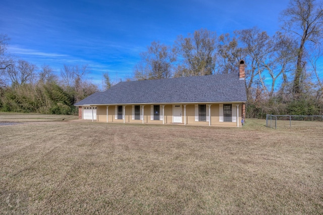 ranch-style home featuring a porch, a garage, and a front lawn