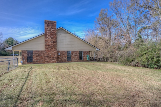 view of side of property featuring a yard