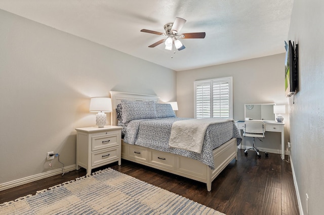 bedroom with ceiling fan and dark hardwood / wood-style flooring