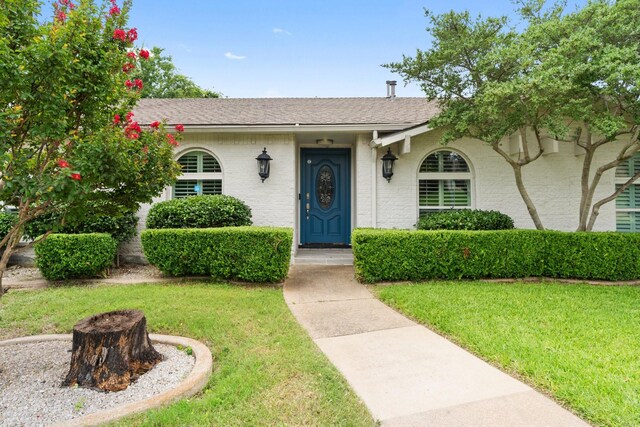 11046 Mccree Rd, Dallas, TX 75238 - view of front of property with a shingled roof and a front lawn