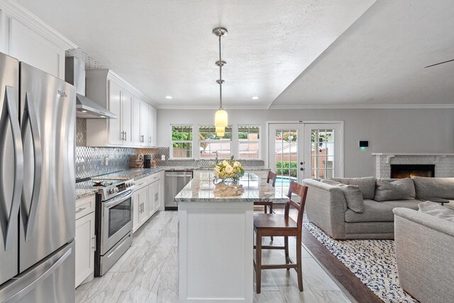 11046 Mccree Rd, Dallas, TX 75238 - kitchen featuring decorative backsplash, marble finish floor, a breakfast bar, french doors, and stainless steel appliances