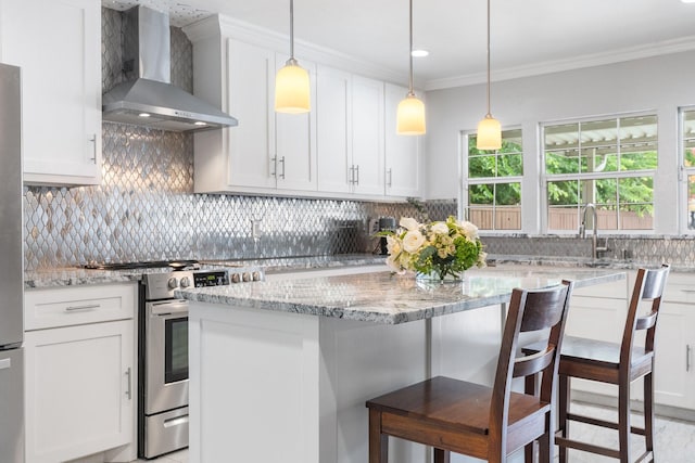 11046 Mccree Rd, Dallas, TX 75238 - kitchen featuring ornamental molding, decorative backsplash, wall chimney range hood, white cabinets, and stainless steel appliances