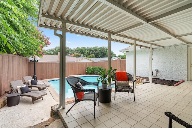 view of patio / terrace featuring a fenced in pool