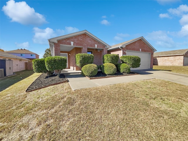 view of front of home featuring a garage and a front yard