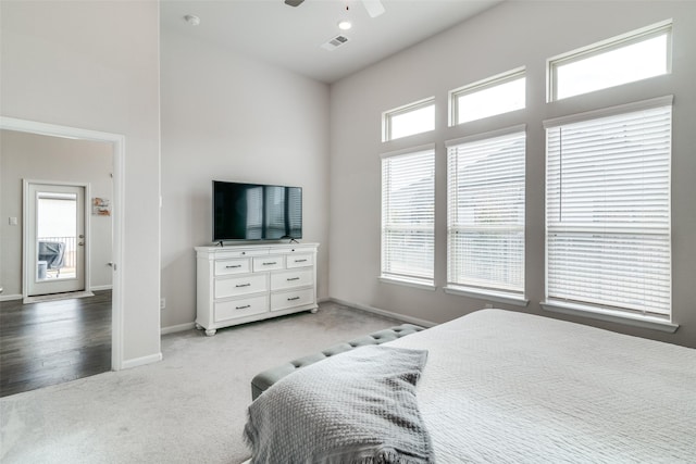 carpeted bedroom with ceiling fan