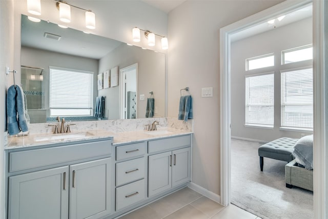 bathroom with tile patterned flooring and vanity