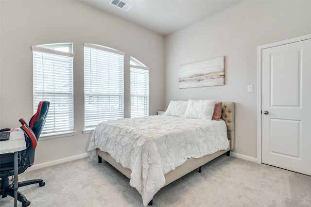 bedroom with light colored carpet