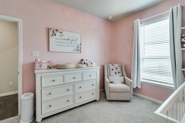 living area featuring light carpet