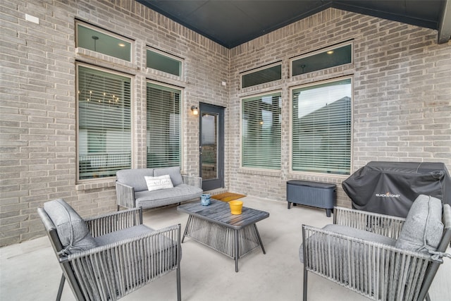 view of patio / terrace featuring an outdoor living space and grilling area