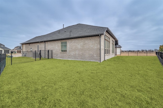 back of house featuring a lawn