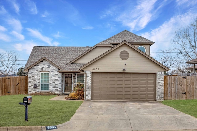 view of front facade with a garage and a front lawn