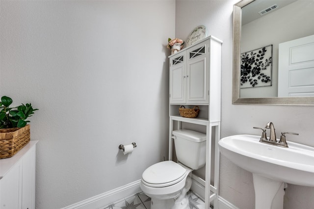 bathroom with sink and toilet