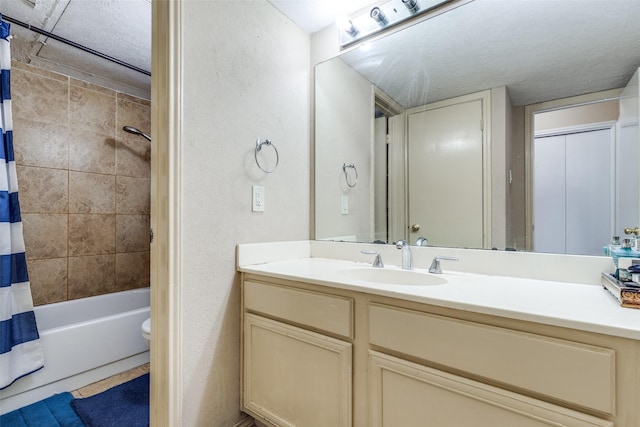 15151 Berry Trl Unit 106, Dallas, TX 75248 - bathroom with vanity, shower / bathtub combination with curtain, and a textured ceiling