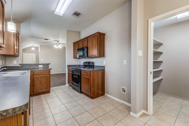 kitchen featuring lofted ceiling, sink, decorative light fixtures, ceiling fan, and black appliances