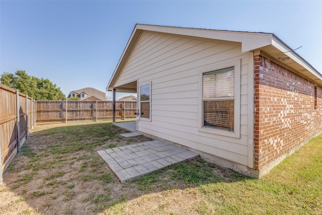 view of property exterior featuring a lawn