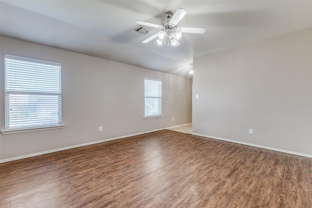 unfurnished room featuring ceiling fan and dark hardwood / wood-style flooring