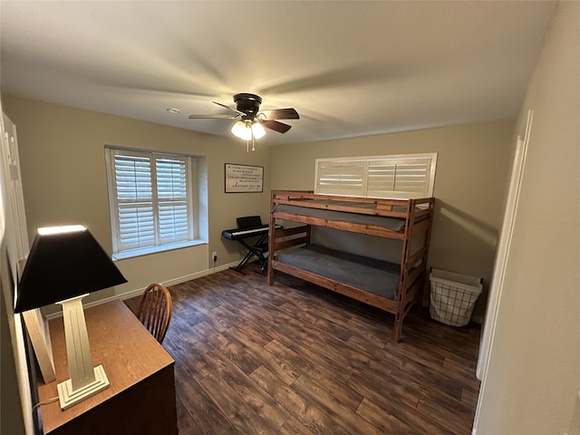 bedroom with dark hardwood / wood-style floors and ceiling fan