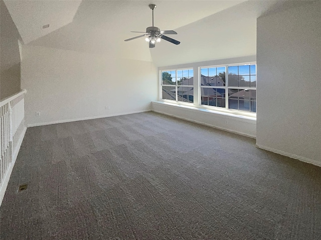 unfurnished living room with high vaulted ceiling, ceiling fan, and carpet