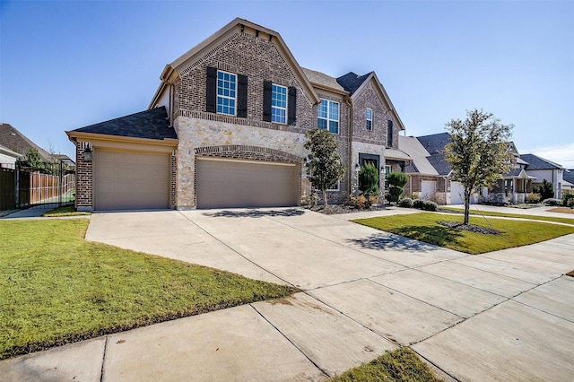 view of front of house with a front yard and a garage