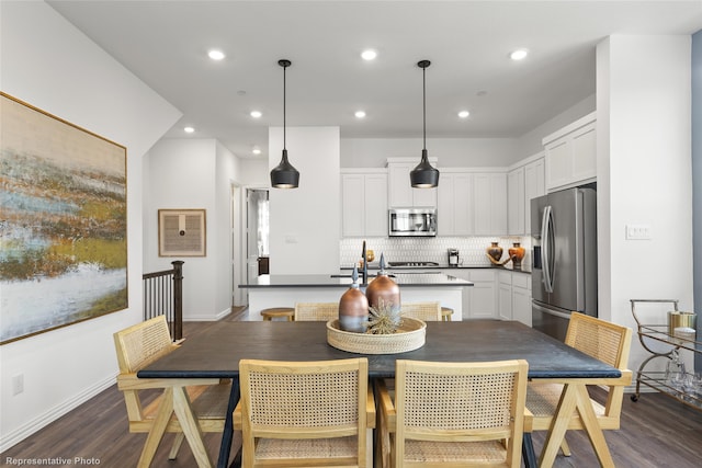 dining area featuring dark wood-type flooring