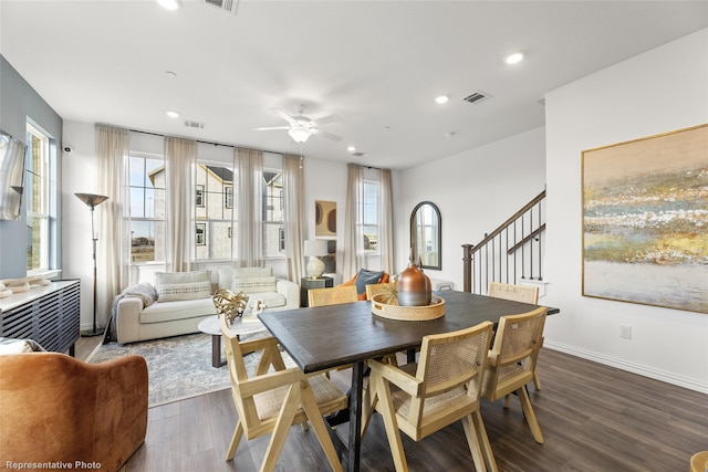 dining area featuring ceiling fan and dark hardwood / wood-style flooring