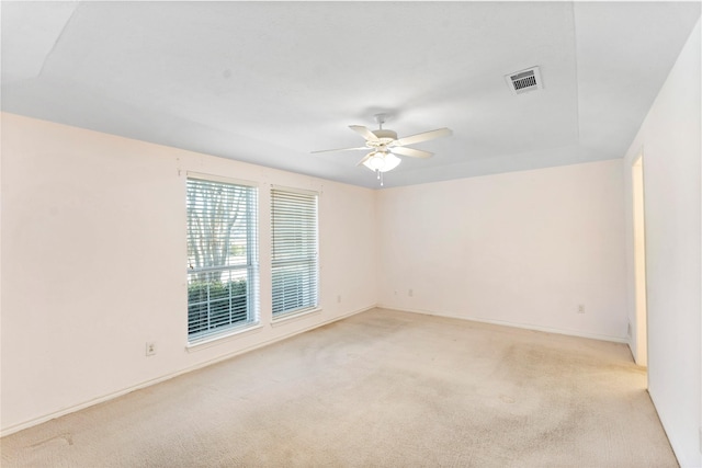 unfurnished room featuring ceiling fan and light colored carpet