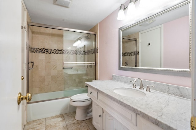 full bathroom featuring bath / shower combo with glass door, toilet, and vanity