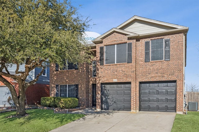 view of front of property featuring a garage, a front lawn, and central AC