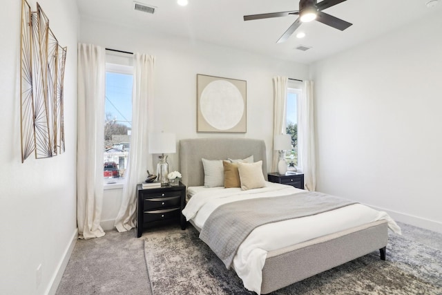 bedroom with ceiling fan and carpet flooring