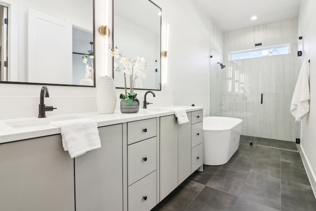 bathroom featuring plus walk in shower and vanity