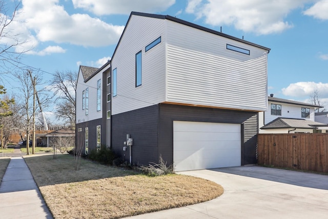 view of side of home featuring a garage