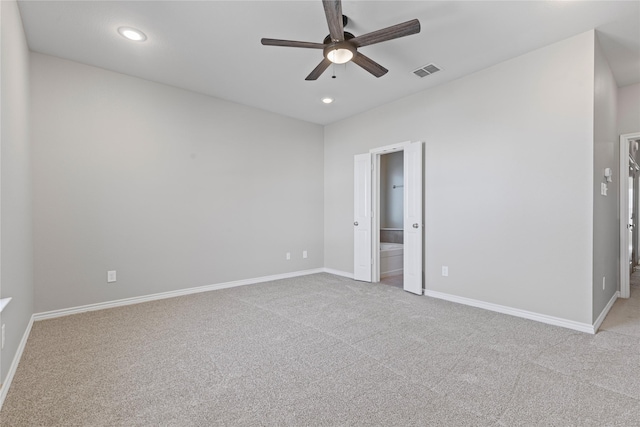 unfurnished bedroom with recessed lighting, visible vents, light carpet, and baseboards