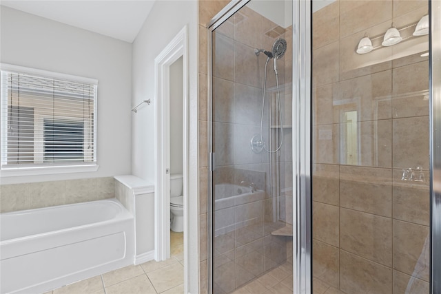 full bathroom featuring tile patterned flooring, a garden tub, a shower stall, and toilet