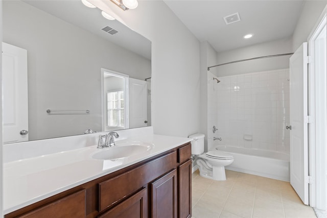 bathroom featuring toilet, vanity, visible vents, and tile patterned floors