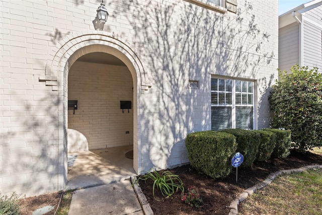 property entrance with brick siding