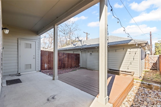 view of patio / terrace featuring fence and a wooden deck