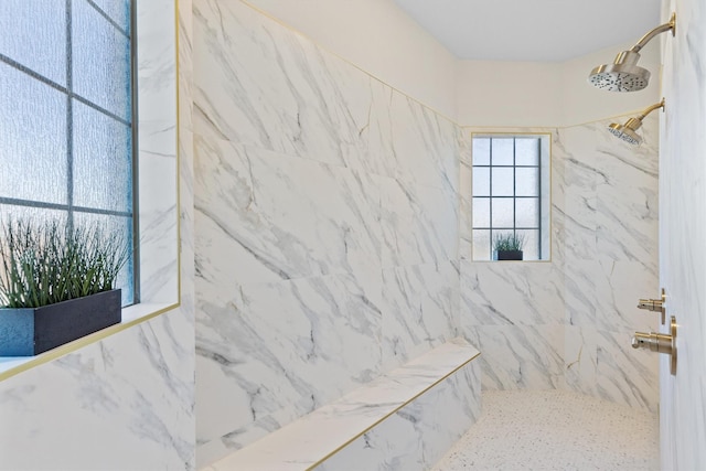 bathroom with tiled shower