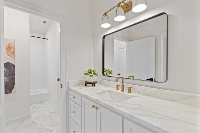 bathroom with vanity and  shower combination