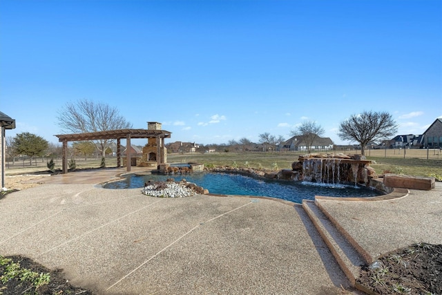 view of swimming pool featuring pool water feature, a patio area, and a pergola