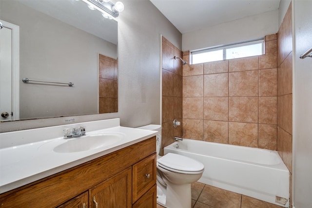 full bathroom featuring vanity, toilet, tile patterned floors, and tiled shower / bath