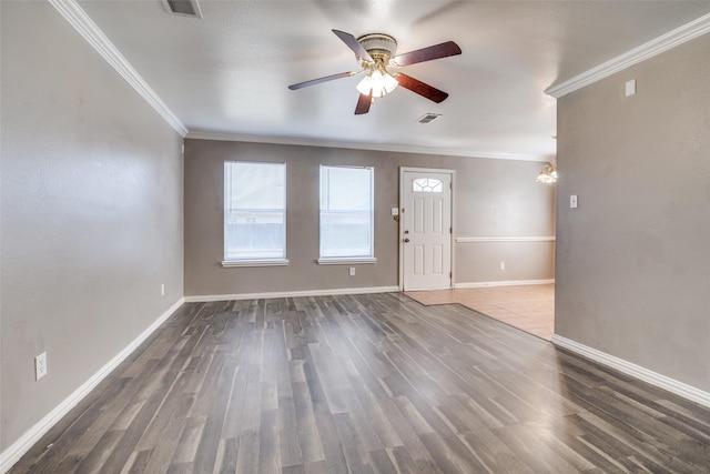 interior space featuring ceiling fan, crown molding, and dark wood-type flooring