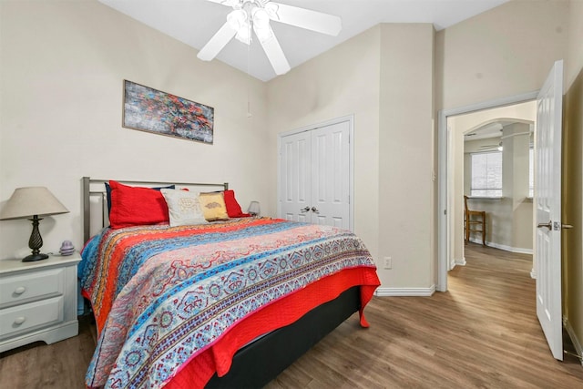 bedroom featuring wood-type flooring, a closet, and ceiling fan