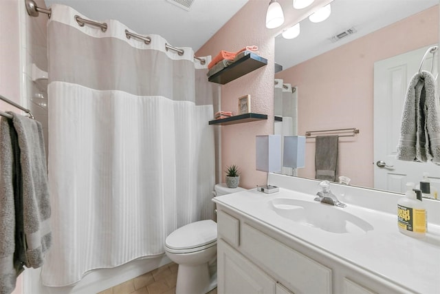 full bathroom featuring vanity, toilet, shower / tub combo, and tile patterned flooring