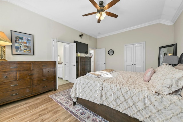 bedroom with light hardwood / wood-style floors, ceiling fan, and ornamental molding