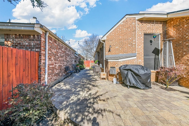 view of side of property featuring a patio