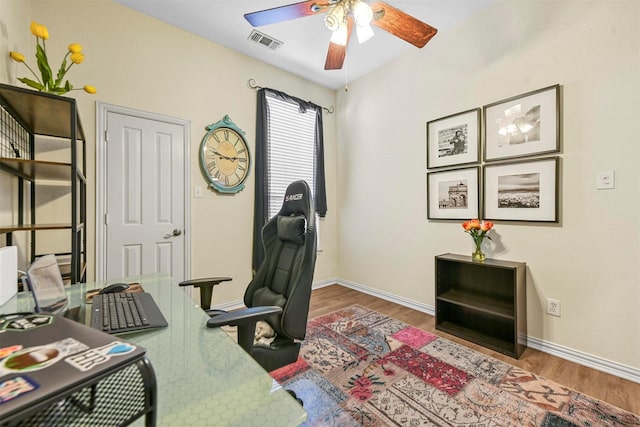 office featuring hardwood / wood-style flooring and ceiling fan