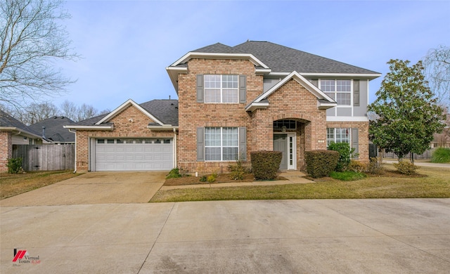 view of front property with a garage and a front yard