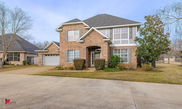 view of front facade with a garage and a front lawn