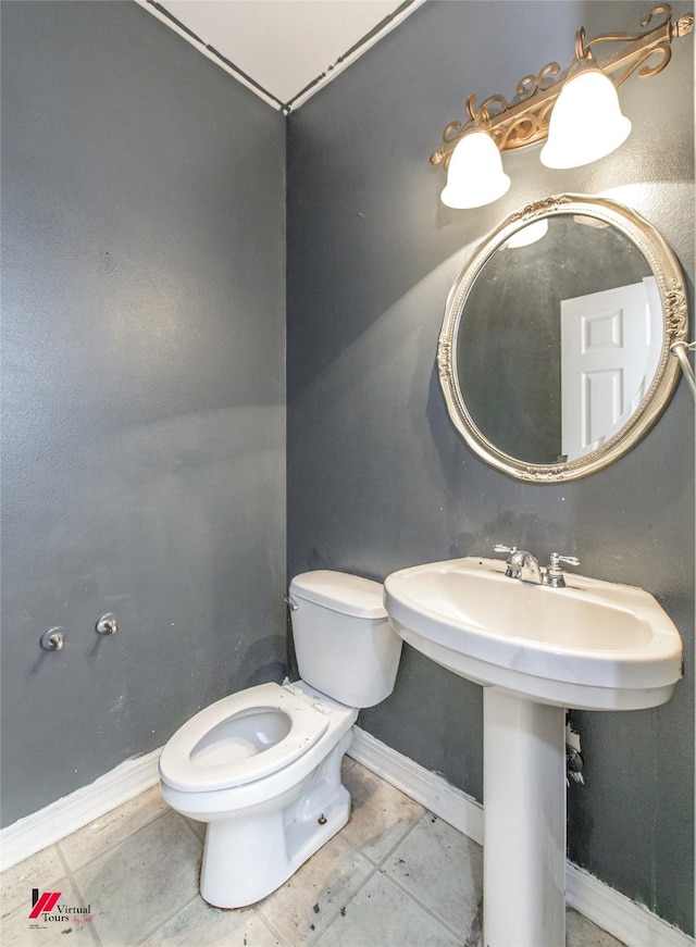 bathroom featuring sink and toilet